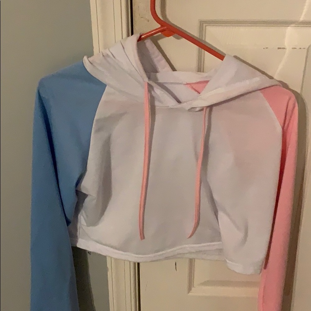 pink,blue, and white crop top with a hood